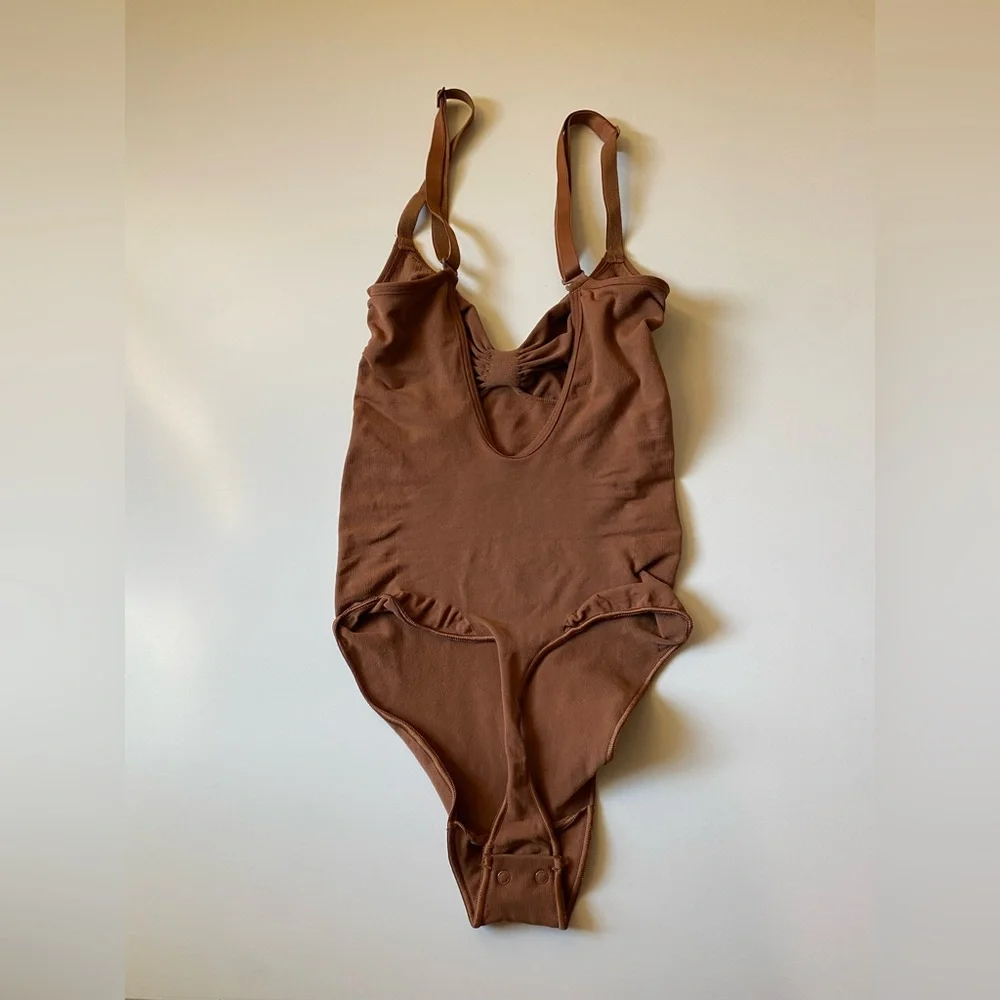 Skims Seamless Sculpting Thong Bodysuit in Bronze